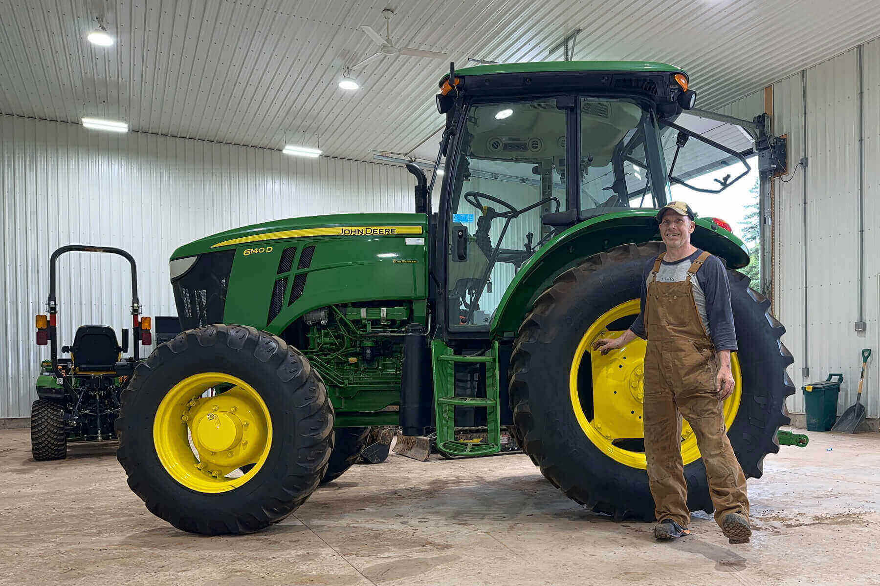 Jeff Shiner, CEO of 1Password, standing in front of a tractor.